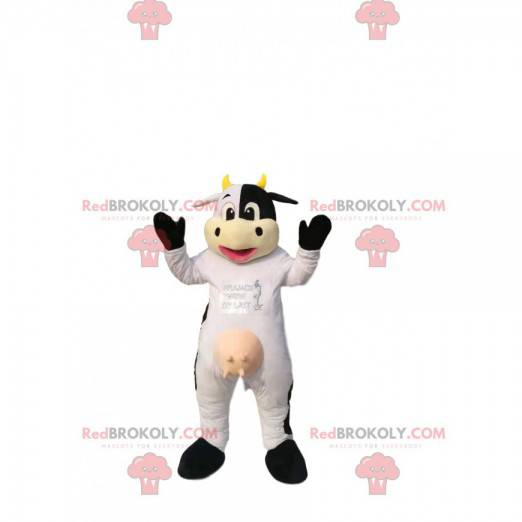 Mascotte mucca bianca e nera, con le corna gialle. -