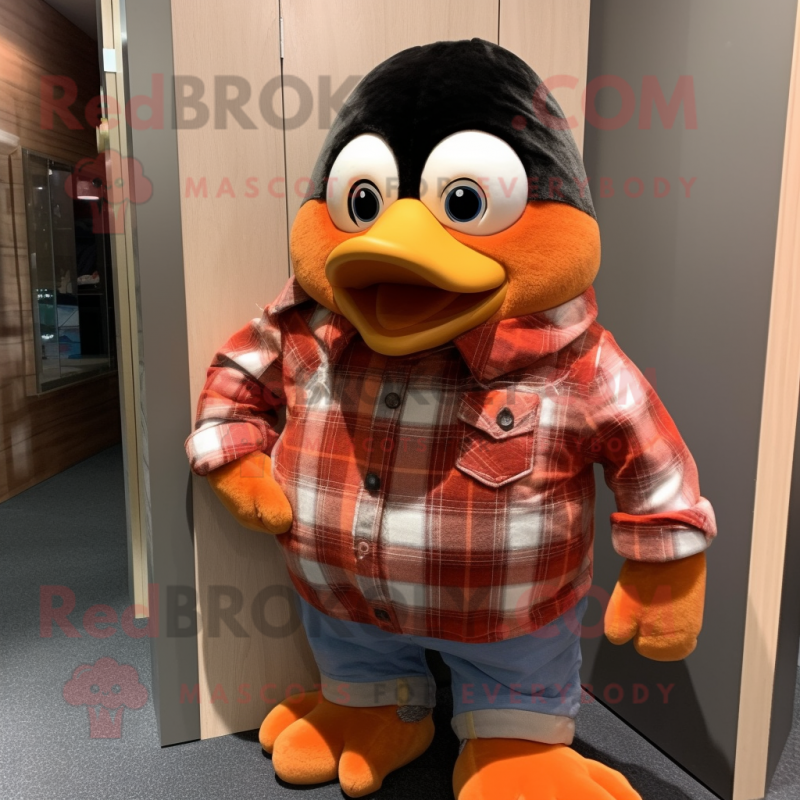 Peach Penguin mascot costume character dressed with a Flannel Shirt and Cufflinks Peach Penguin mascot costume character dressed with a Flannel Shirt and Cufflinks