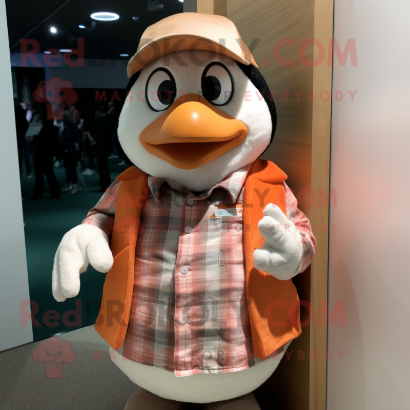 Peach Penguin mascot costume character dressed with a Flannel Shirt and Cufflinks