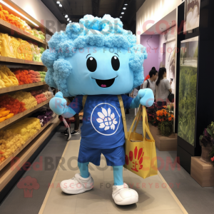 Sky Blue Cauliflower mascot costume character dressed with a Graphic Tee and Tote bags