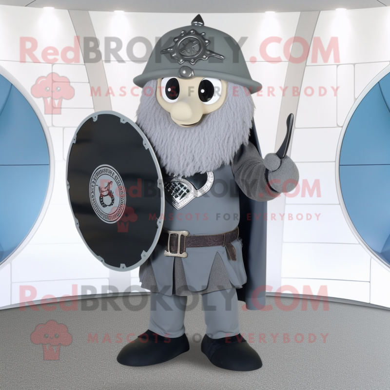Gray Celtic Shield mascot costume character dressed with a Dress Pants and Messenger bags