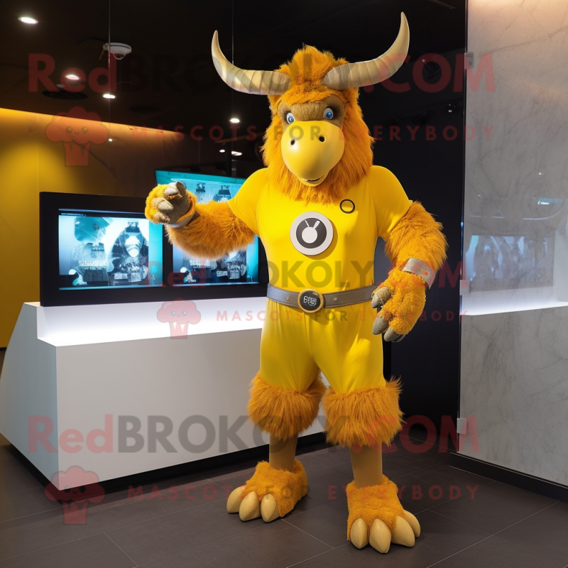 Yellow Minotaur mascot costume character dressed with a Jumpsuit and Digital watches Yellow Minotaur mascot costume character dressed with a Jumpsuit and Digital watches