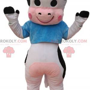 Black and white cow mascot with a blue jersey - Redbrokoly.com