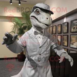 Gray Iguanodon mascot costume character dressed with a Dress Shirt and Hat pins