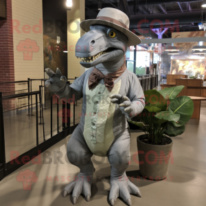 Gray Iguanodon mascot costume character dressed with a Dress Shirt and Hat pins