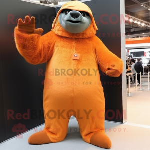 Orange Giant Sloth mascot costume character dressed with a Trousers and Beanies