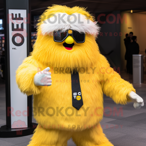 Yellow Yeti mascot costume character dressed with a Blazer and Sunglasses