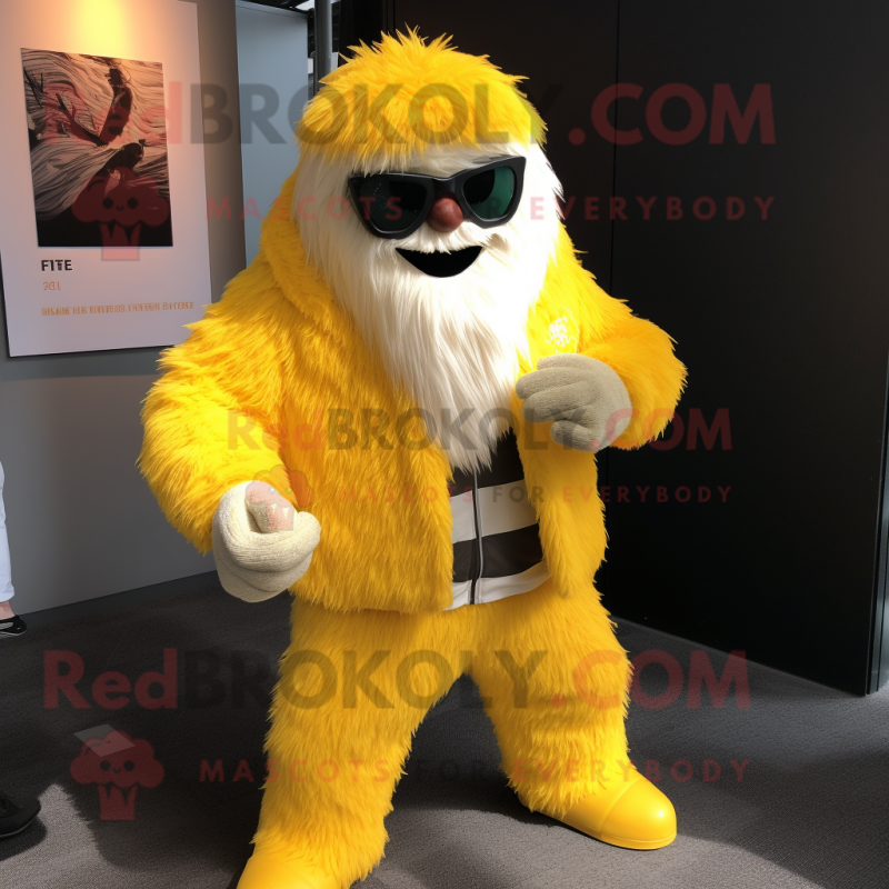 Yellow Yeti mascot costume character dressed with a Blazer and Sunglasses Yellow Yeti mascot costume character dressed with a Blazer and Sunglasses