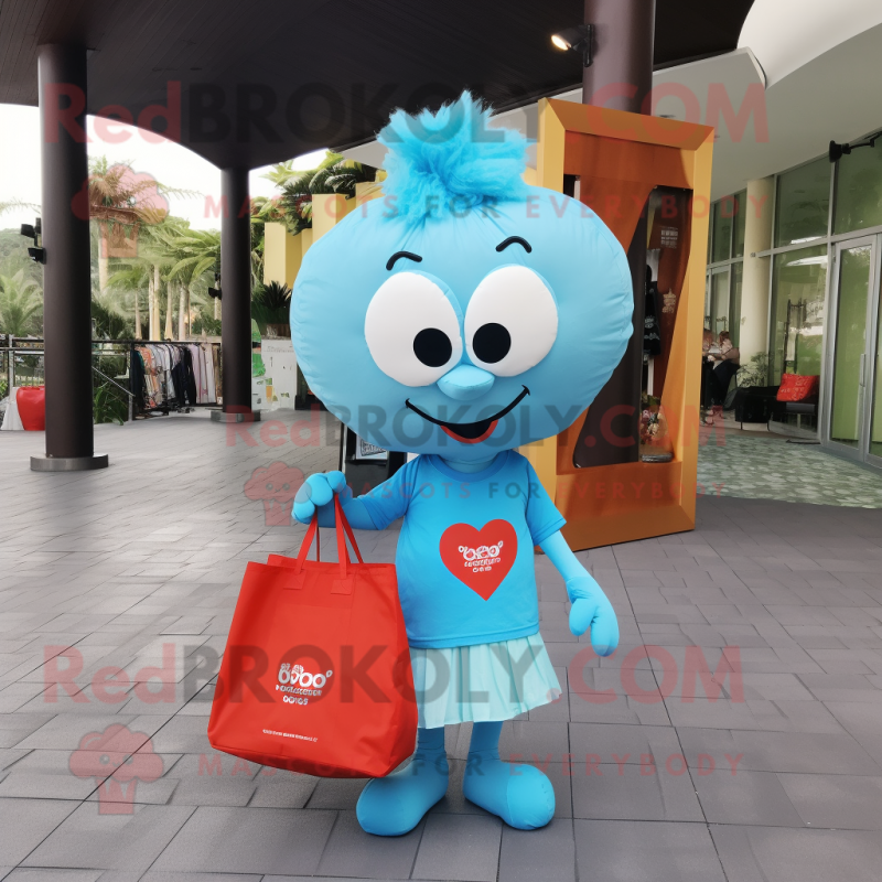 Sky Blue Heart mascot costume character dressed with a T-Shirt and Tote bags Sky Blue Heart mascot costume character dressed with a T-Shirt and Tote bags