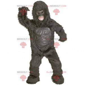 Mascote gigante gorila preto com aparência feroz -