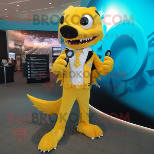 Yellow Barracuda mascot costume character dressed with a Suit and Smartwatches