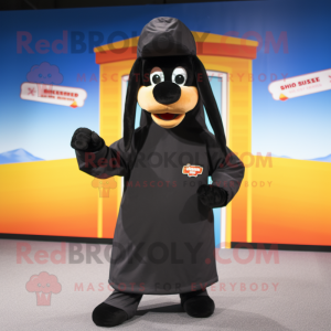 Black Hot Dogs mascot costume character dressed with a Parka and Headbands