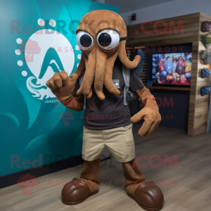 Brown Kraken mascot costume character dressed with a Board Shorts and Bracelet watches