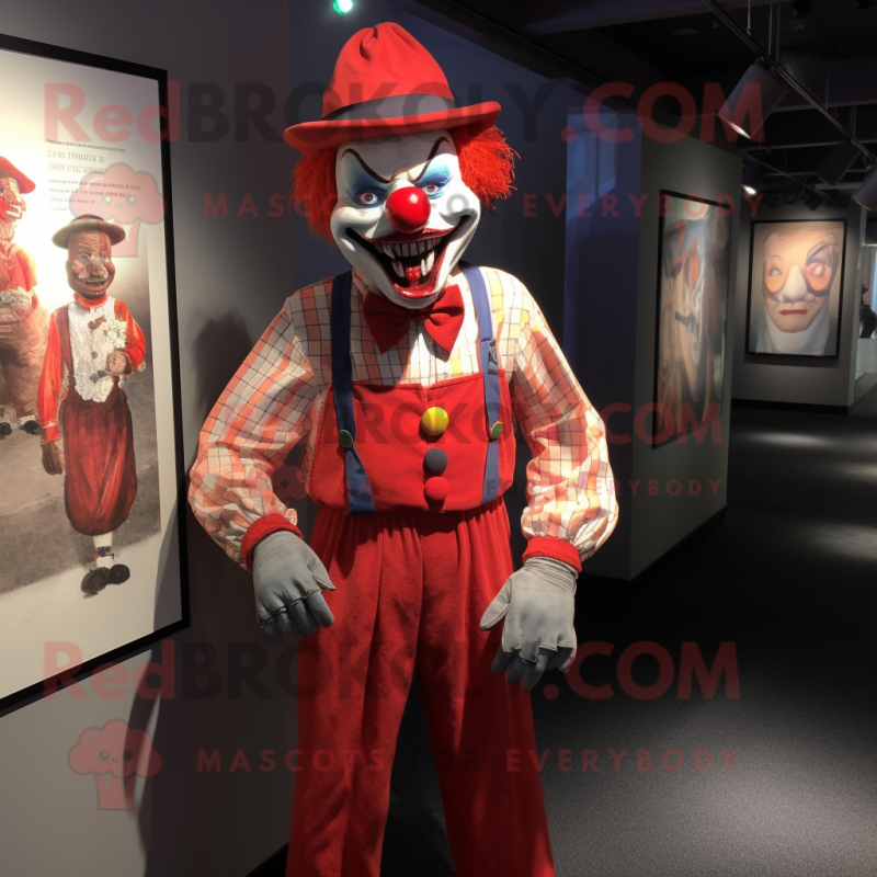 Red Evil Clown mascot costume character dressed with a Oxford Shirt and Suspenders