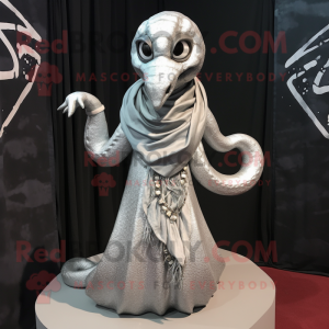 Silver Hydra mascot costume character dressed with a Blouse and Shawl pins