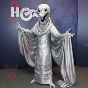 Silver Hydra mascot costume character dressed with a Blouse and Shawl pins
