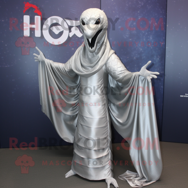 Silver Hydra mascot costume character dressed with a Blouse and Shawl pins