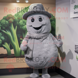 Gray Broccoli mascot costume character dressed with a Cover-up and Hat pins