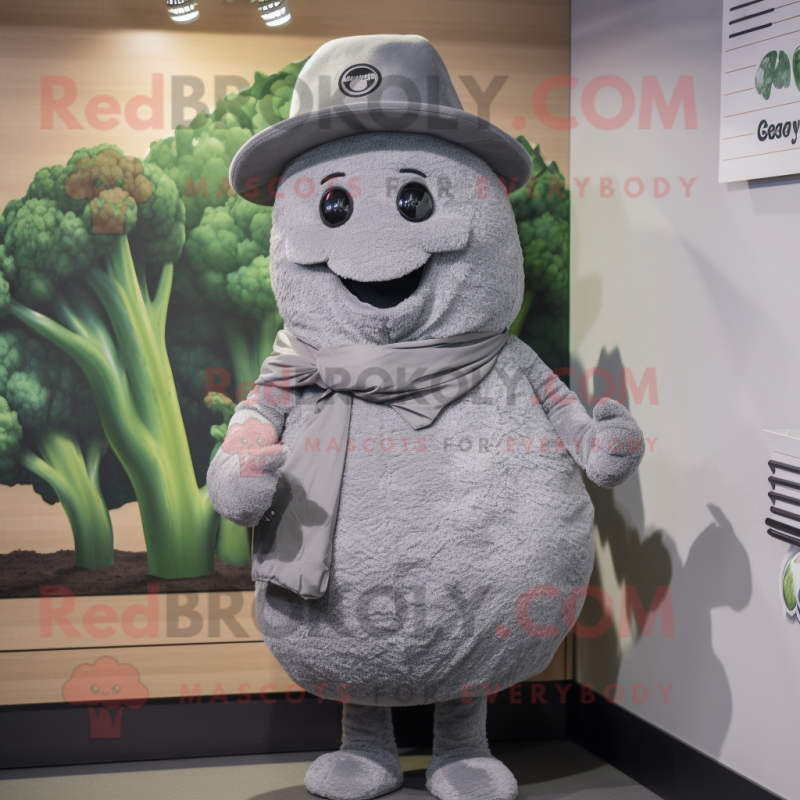 Gray Broccoli mascot costume character dressed with a Cover-up and Hat pins