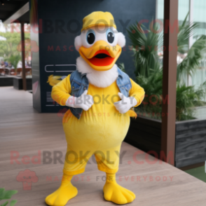 Yellow Swans mascot costume character dressed with a Denim Shorts and Headbands