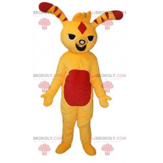 Mascote de criatura divertido amarelo e vermelho. Fantasia de