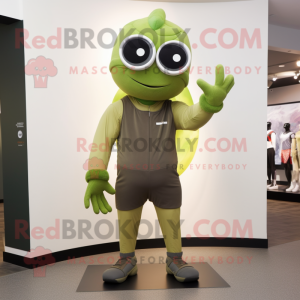 Olive Cyclops mascot costume character dressed with a Joggers and Gloves