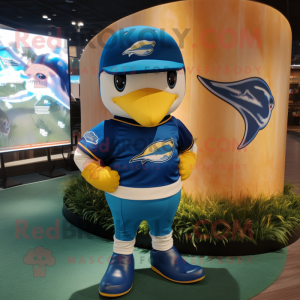 Gold Blue Whale mascot costume character dressed with a Rugby Shirt and Berets