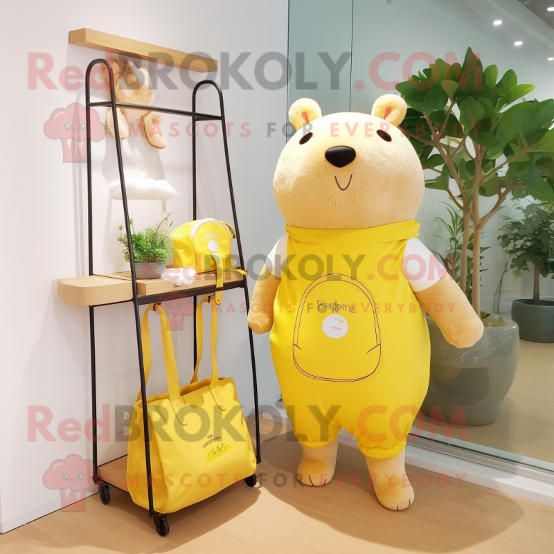 Lemon Yellow Capybara mascot costume character dressed with a Romper and Tote bags