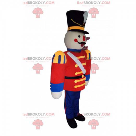 Mascota del soldado con una chaqueta roja y un gran sombrero