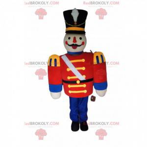 Soldier mascot with a red jacket and a large black hat -