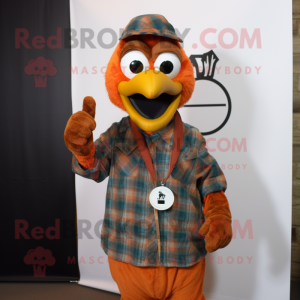 Rust Peacock mascot costume character dressed with a Flannel Shirt and Keychains