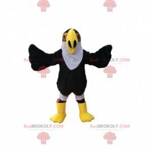 Mascotte d'aigle noir avec un grand bec jaune. Costume d'aigle