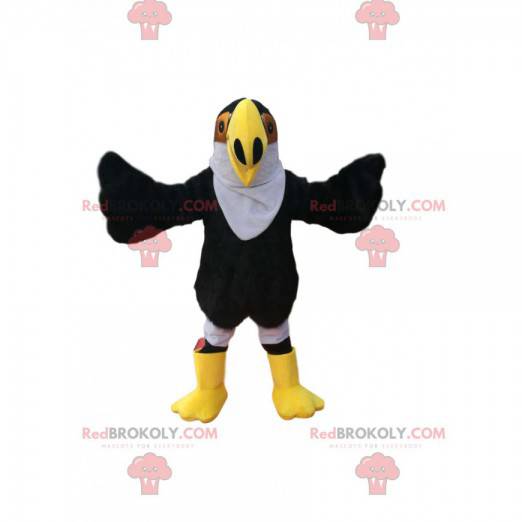 Mascot black eagle with a large yellow beak. Eagle costume -