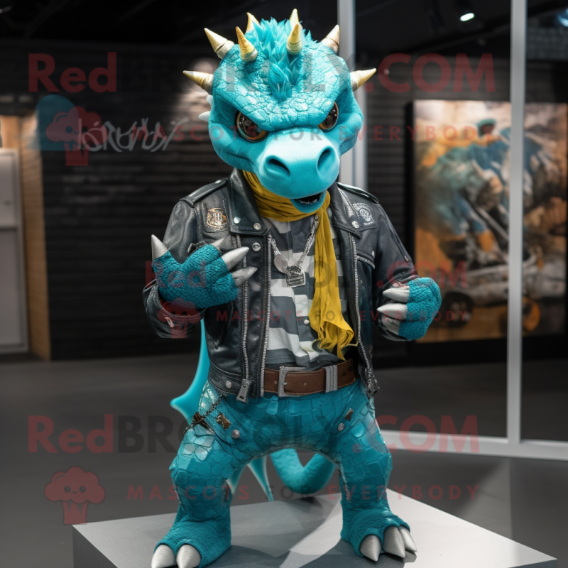 Turquoise Dragon mascot costume character dressed with a Biker Jacket and Shoe laces Turquoise Dragon mascot costume character dressed with a Biker Jacket and Shoe laces