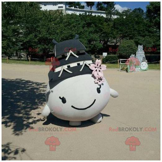 Mascot all round and smiling with a roof on the head -