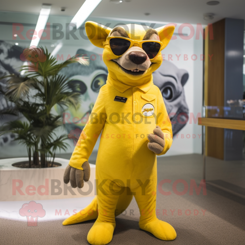 Lemon Yellow Thylacosmilus mascot costume character dressed with a Swimwear and Sunglasses