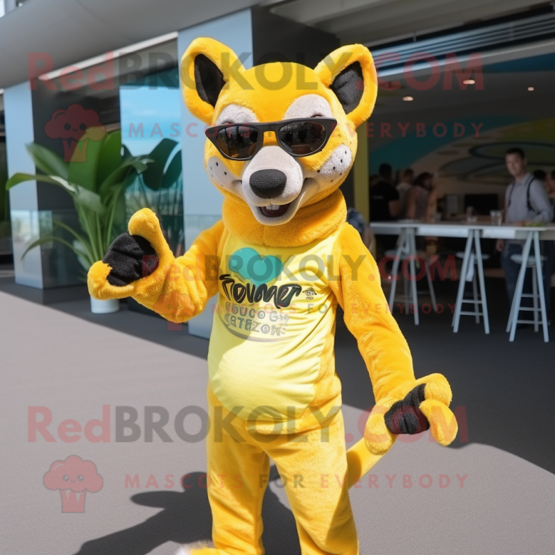 Lemon Yellow Thylacosmilus mascot costume character dressed with a Swimwear and Sunglasses Lemon Yellow Thylacosmilus mascot costume character dressed with a Swimwear and Sunglasses