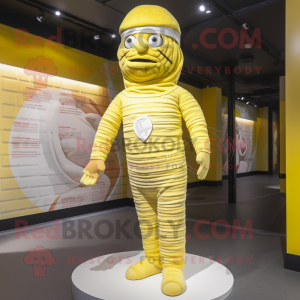 Lemon Yellow Mummy mascot costume character dressed with a Trousers and Berets