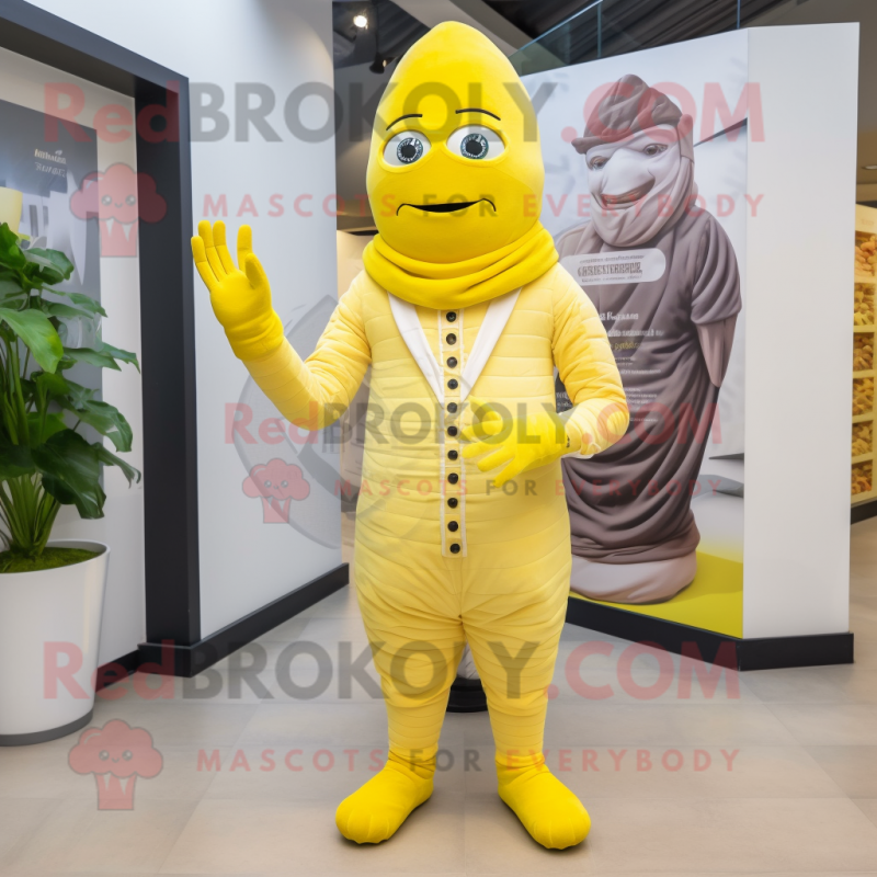 Lemon Yellow Mummy mascot costume character dressed with a Trousers and Berets