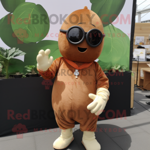 Brown Pear mascot costume character dressed with a Playsuit and Sunglasses