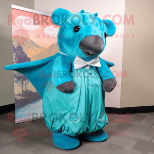 Turquoise Stellar'S Sea Cow mascot costume character dressed with a Dress and Bow ties