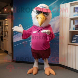 Magenta Bald Eagle mascot costume character dressed with a Swimwear and Caps