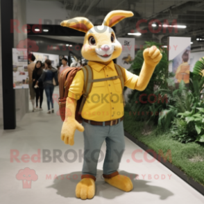 Yellow Wild Rabbit mascot costume character dressed with a Skinny Jeans and Messenger bags