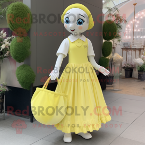 Lemon Yellow Mime mascot costume character dressed with a Ball Gown and Tote bags