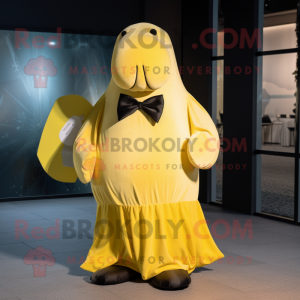 Lemon Yellow Walrus mascot costume character dressed with a Maxi Skirt and Bow ties