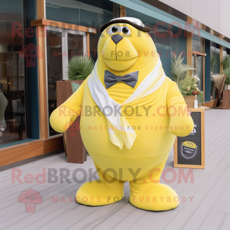 Lemon Yellow Walrus mascot costume character dressed with a Maxi Skirt and Bow ties Lemon Yellow Walrus mascot costume character dressed with a Maxi Skirt and Bow ties