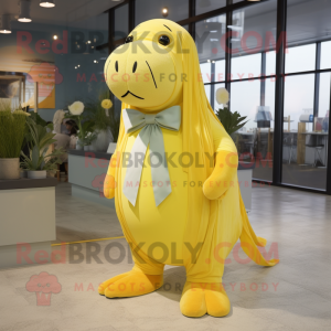 Lemon Yellow Walrus mascot costume character dressed with a Maxi Skirt and Bow ties