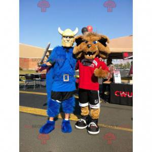 2 mascots: a Viking with a blue cape and a sporting wolf -