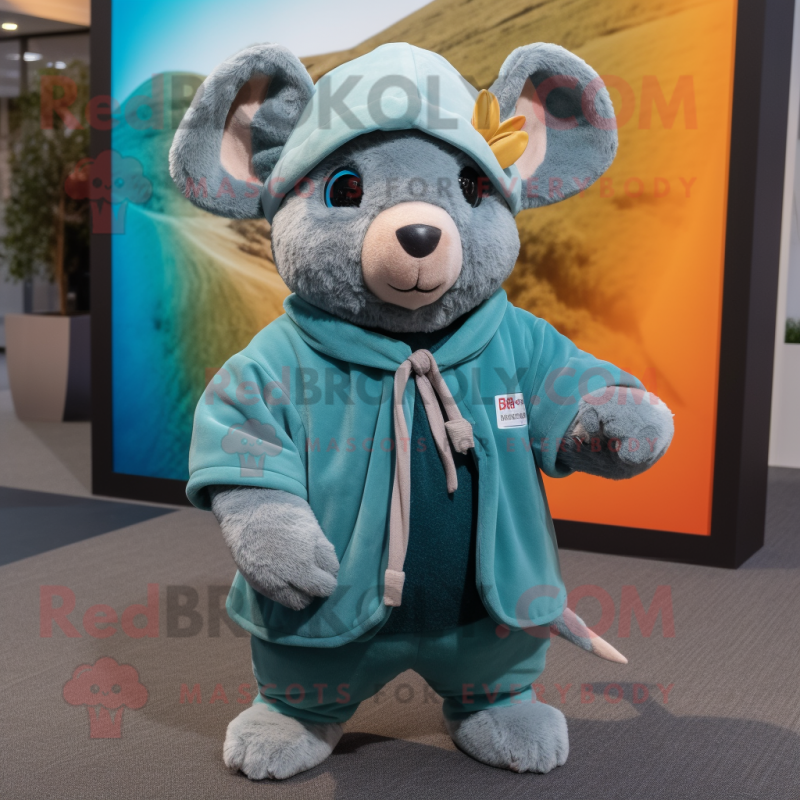 Teal Chinchilla mascot costume character dressed with a Cover-up and Beanies