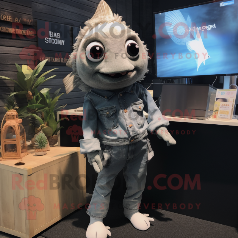 Gray Goldfish mascot costume character dressed with a Bootcut Jeans and Brooches